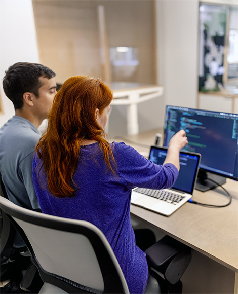 two people looking at the API connections all partners get access to with the FreeWheel Partner Portal